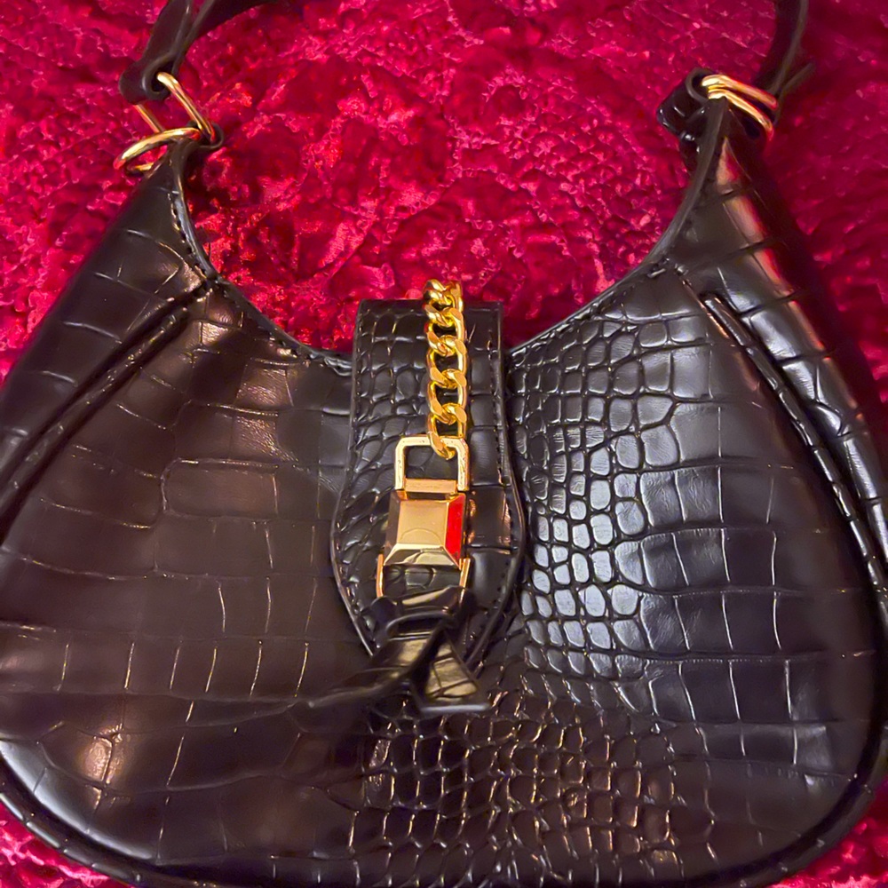 Black faux leather textured bag
